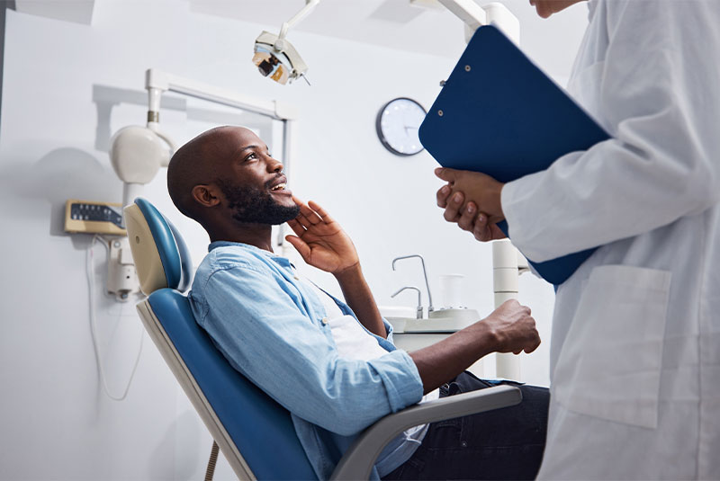 young man having a consultation with his dentist.