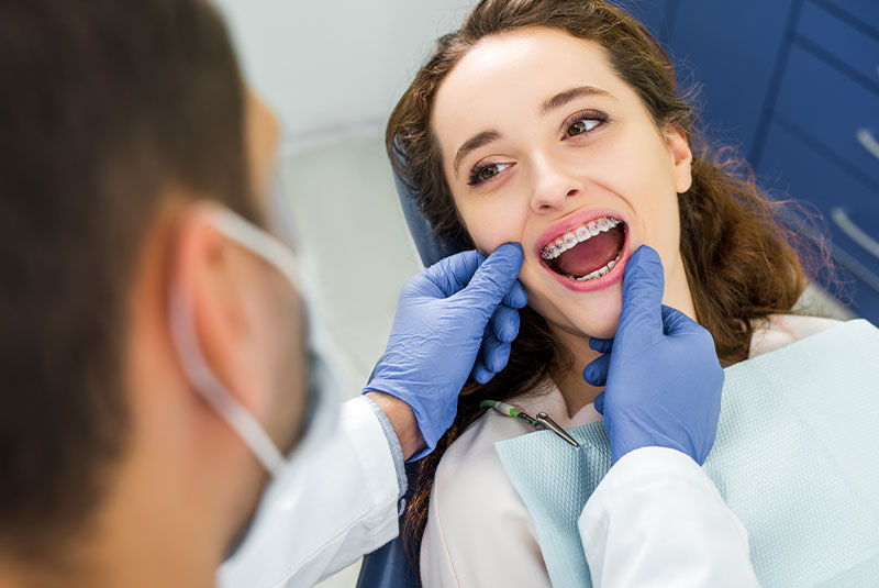 female patient being examined for the orthodontics procedure