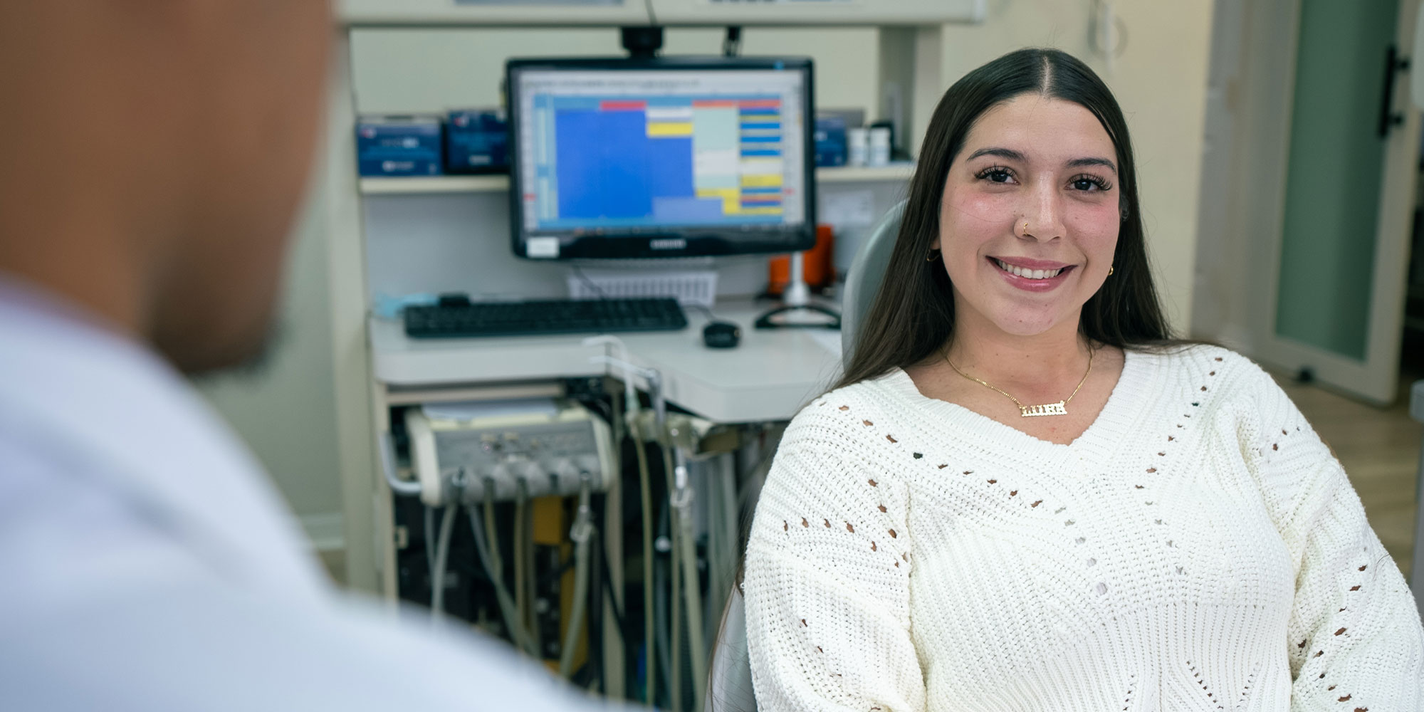 patient smiling brightly while getting prepped for their dental treatment