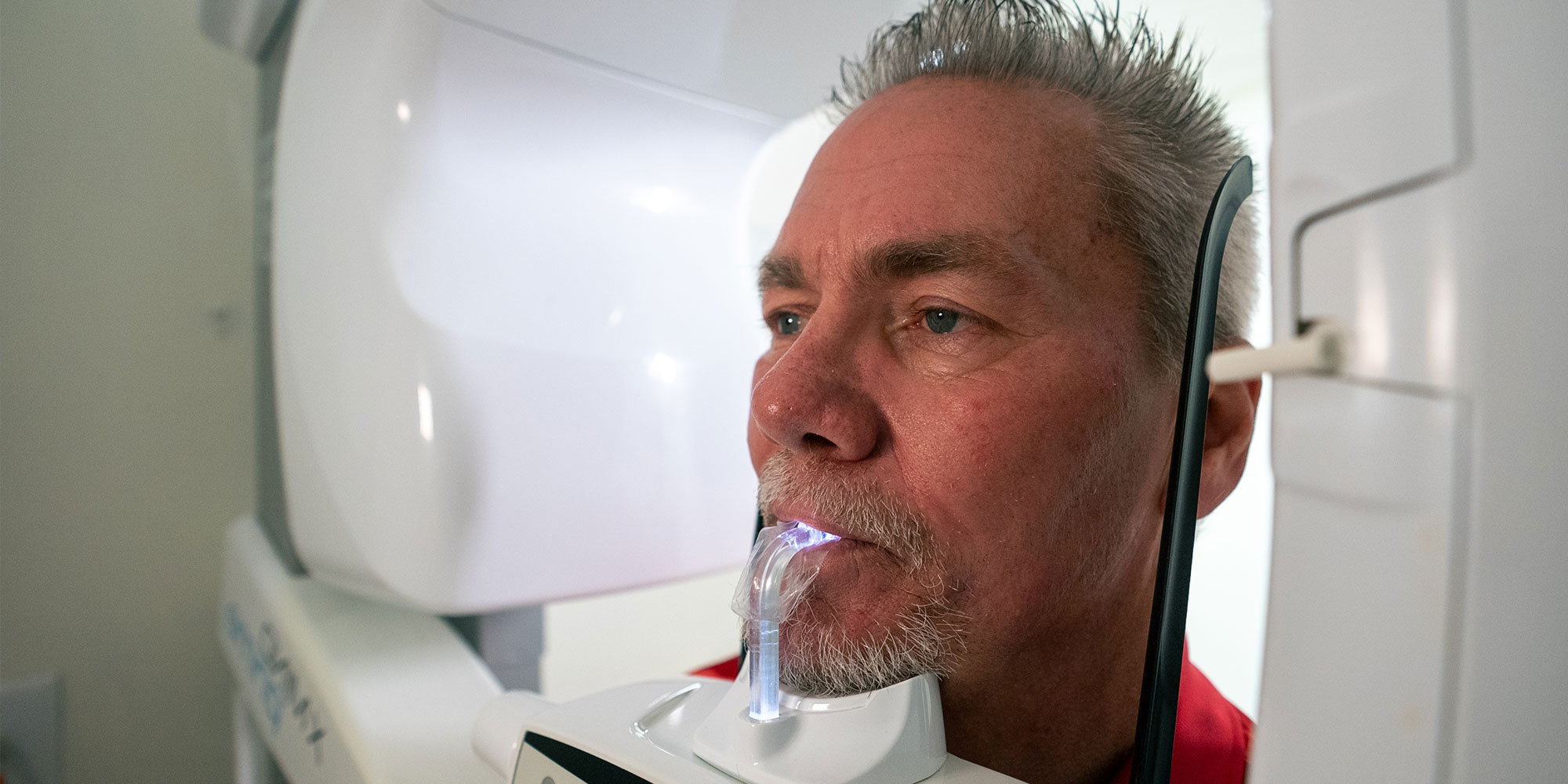 patient undergoing a cbct scan for their dental treatment