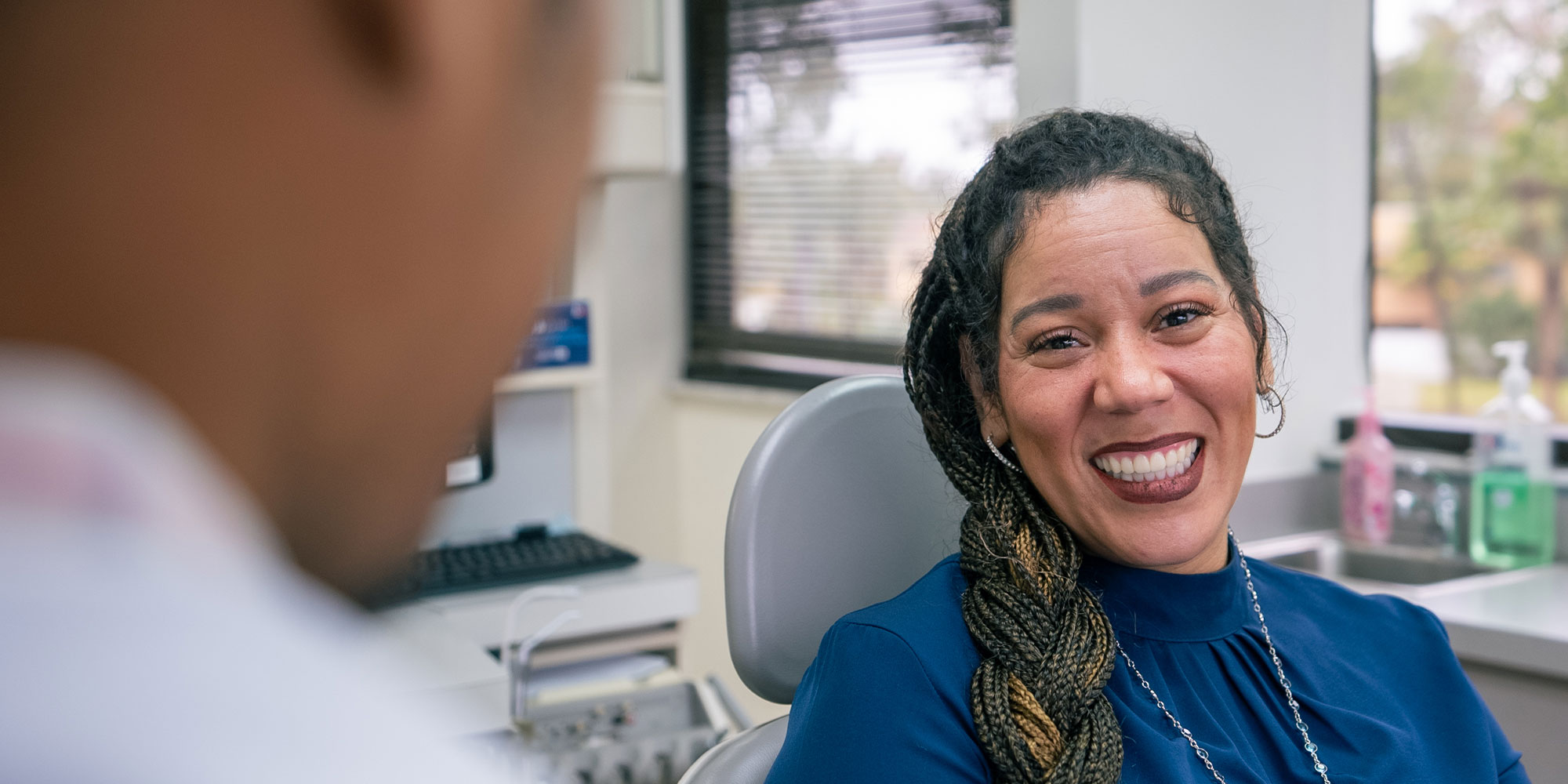 patient smiling brightly and prep and ready their dental treatment