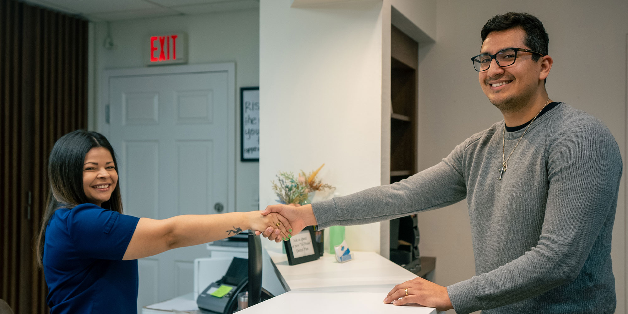 team member shaking patients hand